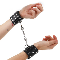 KINK - WRIST RESTRAINTS WITH SNAP CLOSURE FULL OF RIVETS BLACK ADJUSTABLE 19-24CM X 5.5CM